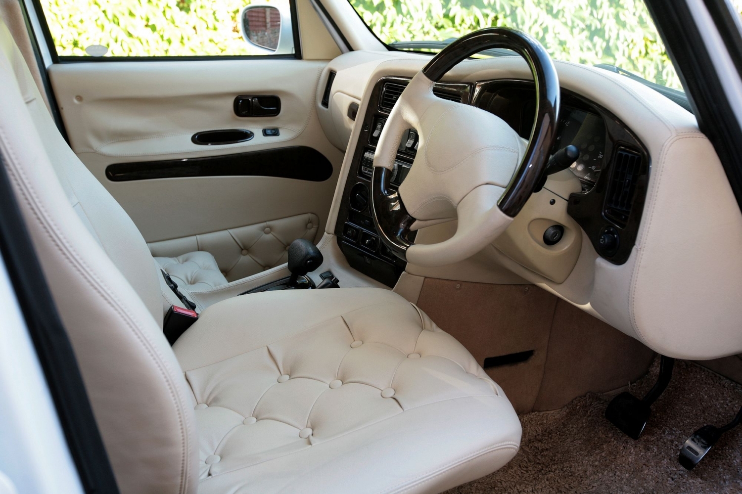 wedding car hire London white taxi side view