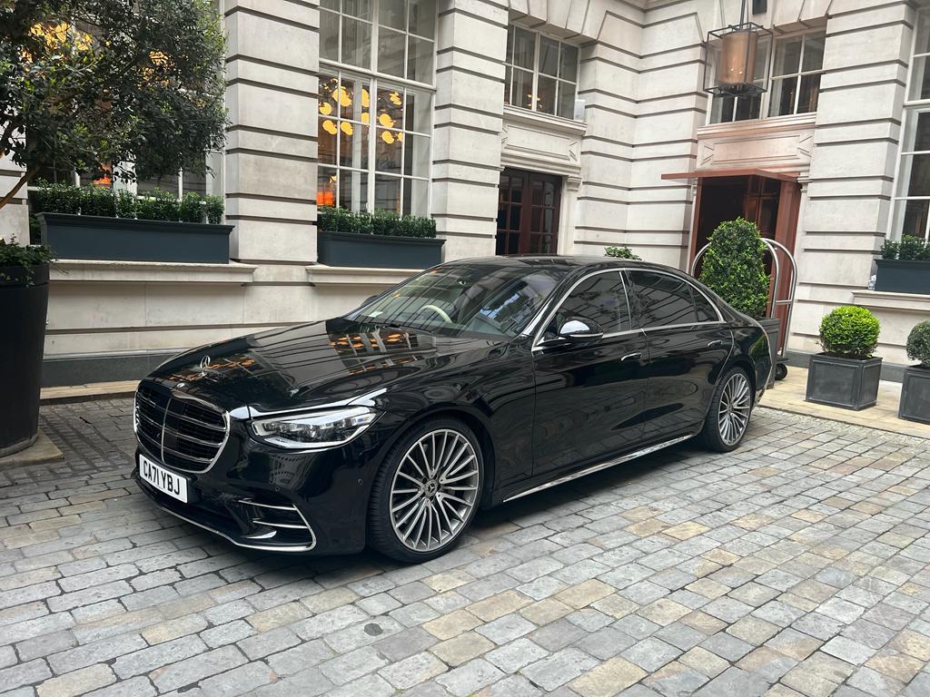 Luxury chauffeur service London white leather interior reclining seats