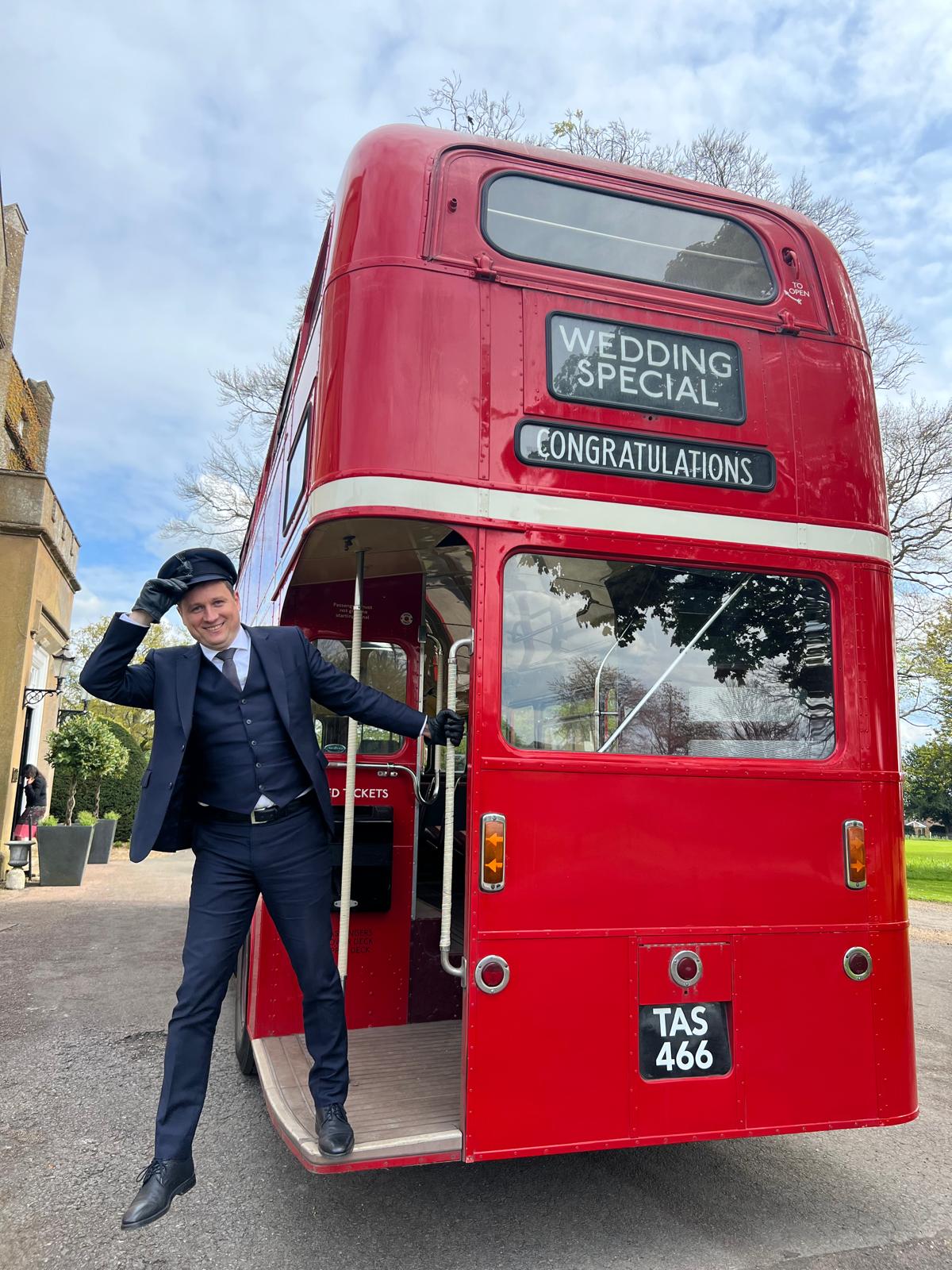 Vintage red London Routemaster wedding bus with chauffeur