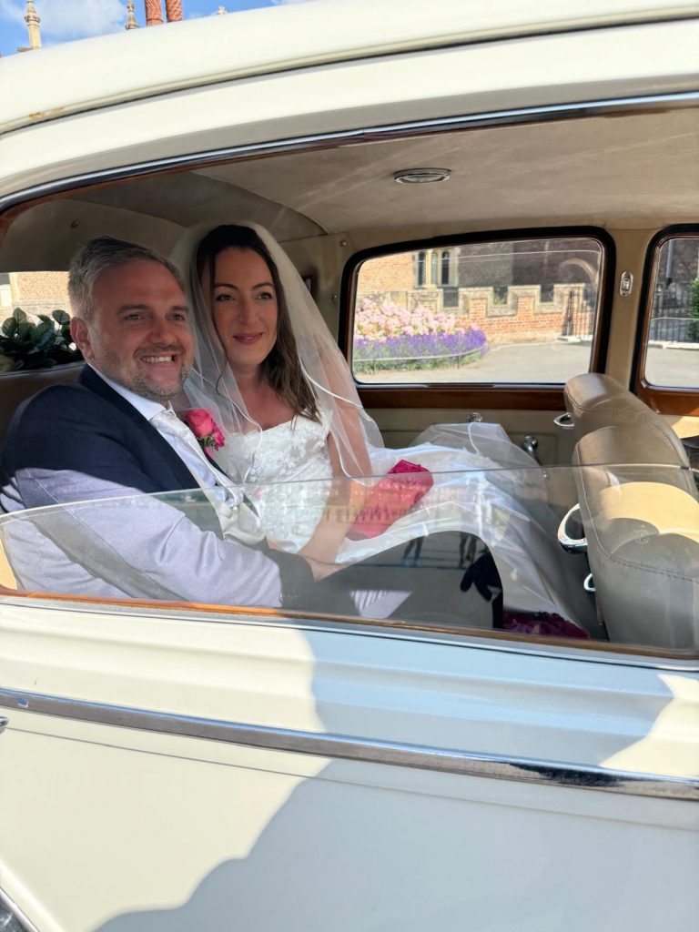 Luxury wedding car hire London with ribbons and flowers
