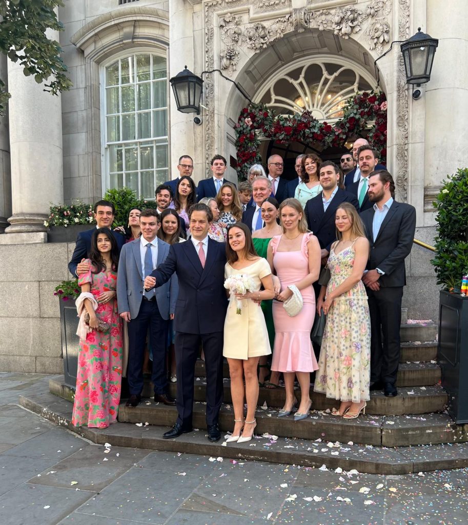 Vintage wedding car outside Chelsea Town Hall with bride in London