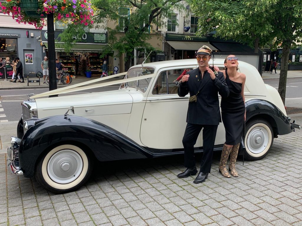 Bride arriving in vintage wedding car at Islington Town Hall London