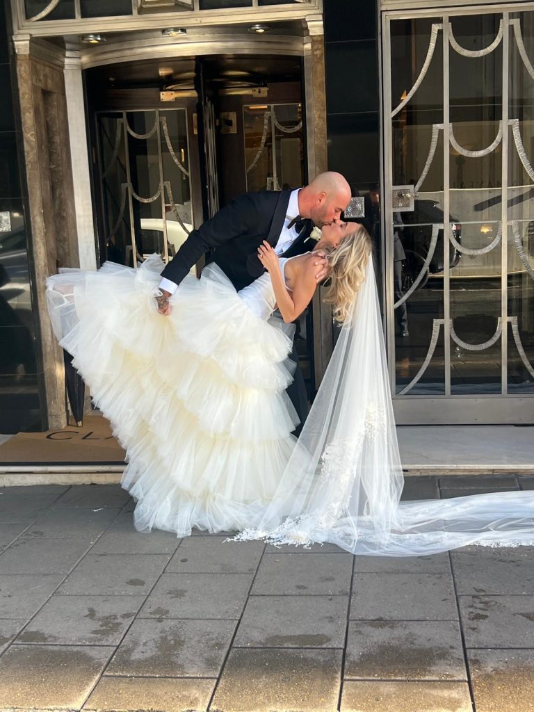 Bride arriving in a Rolls Royce during summer luxury wedding car hire season