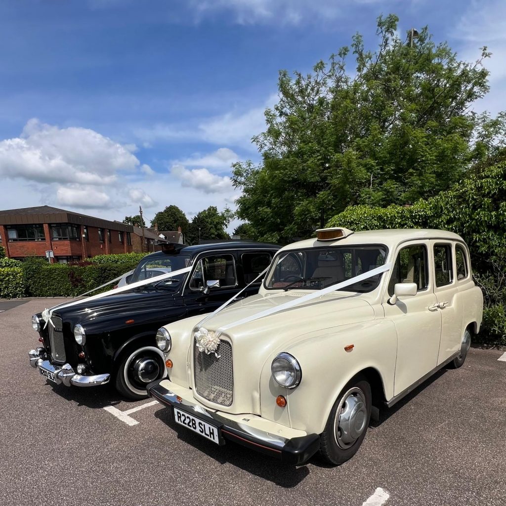 White Wedding Taxi and Classic Black Wedding Cab side by side